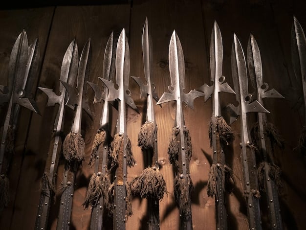 A close-up shot of different weapons in Monster Hunter World, each with its unique design and elemental properties. Display the Great Sword, Long Sword, Hammer, and Bow.