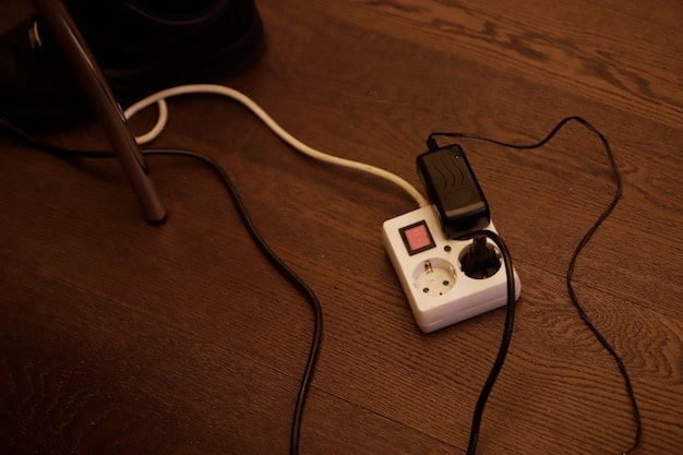 A close-up of a modern gaming console with a controller plugged in, with a blurred background of a gamer's setup, including a screen and headphones. The light is focused on the console's ports and connections, emphasizing the physical connection and data transfer.