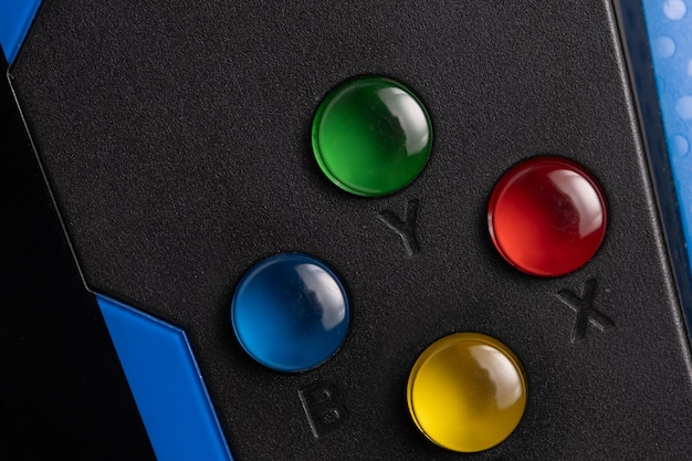 Close-up shot of a game console screen with a progress bar indicating a firmware update in progress. The background shows various game cartridges and controllers.