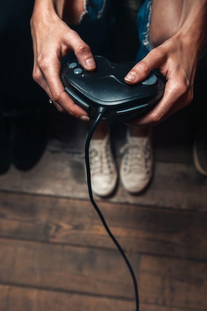 A close-up shot of a hand connecting an HDMI cable to the back of an old PlayStation 2 console. The background is slightly blurred, focusing on the connection point.