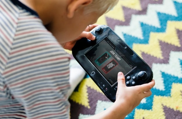 A close up of a used Nintendo Switch with the joy cons attached. The screen is on and displaying a game. The setting is bright and shows the device being held by a person.